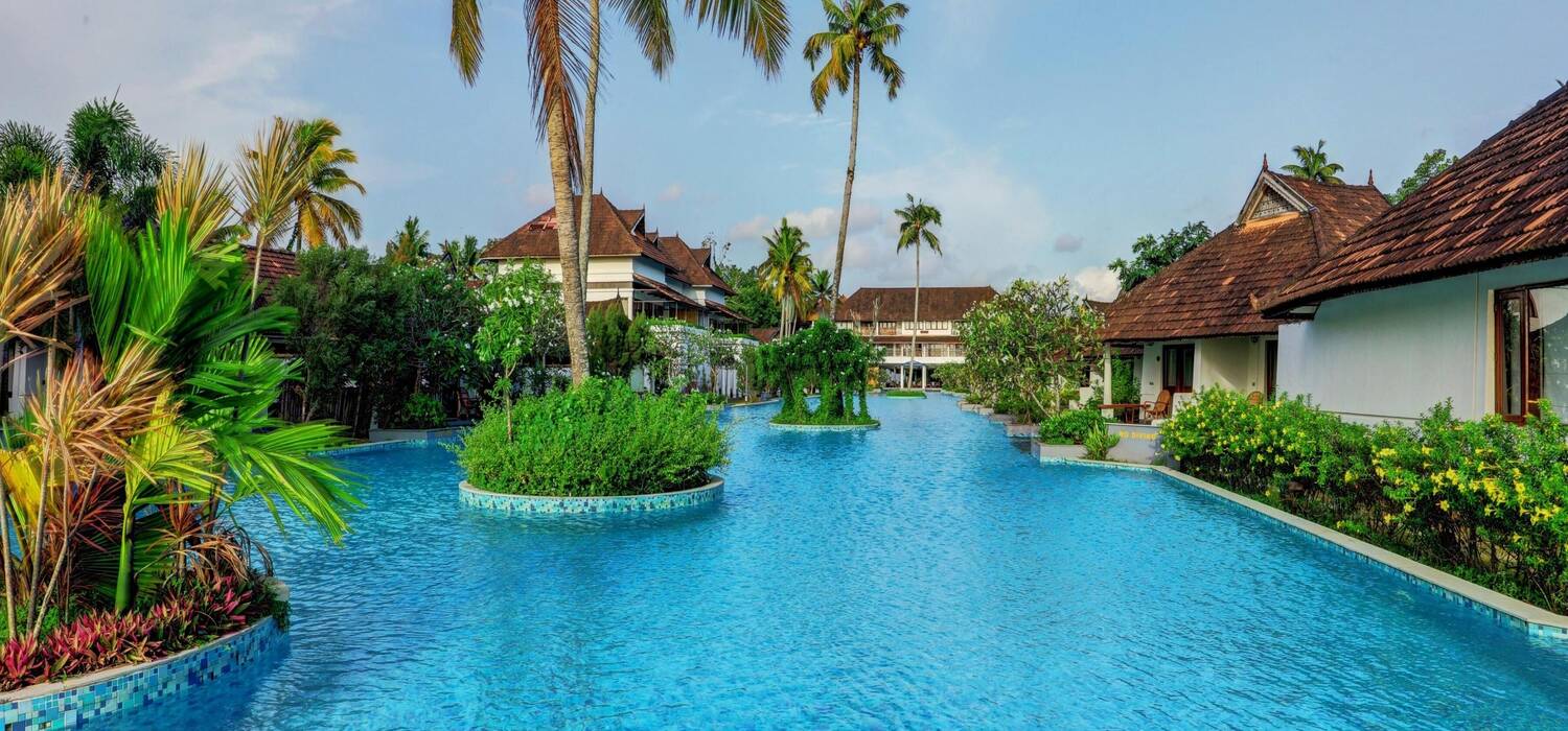 Pool alongside villas for sale in Kerala Near Kochi and Kottayam at Rhythm ResiTel.